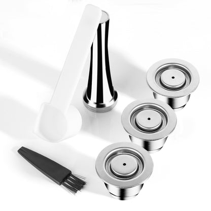 Three stainless steel coffee capsules with accompanying tamper. All on a white background. Includes a free brush and scoop.