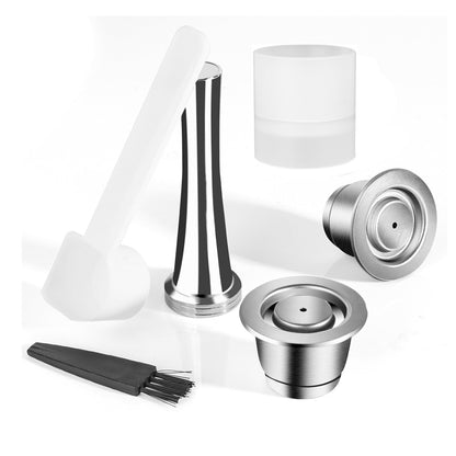 Two stainless steel coffee capsules with tamper and Filling Holder. All on a white background. Includes a free brush and scoop.